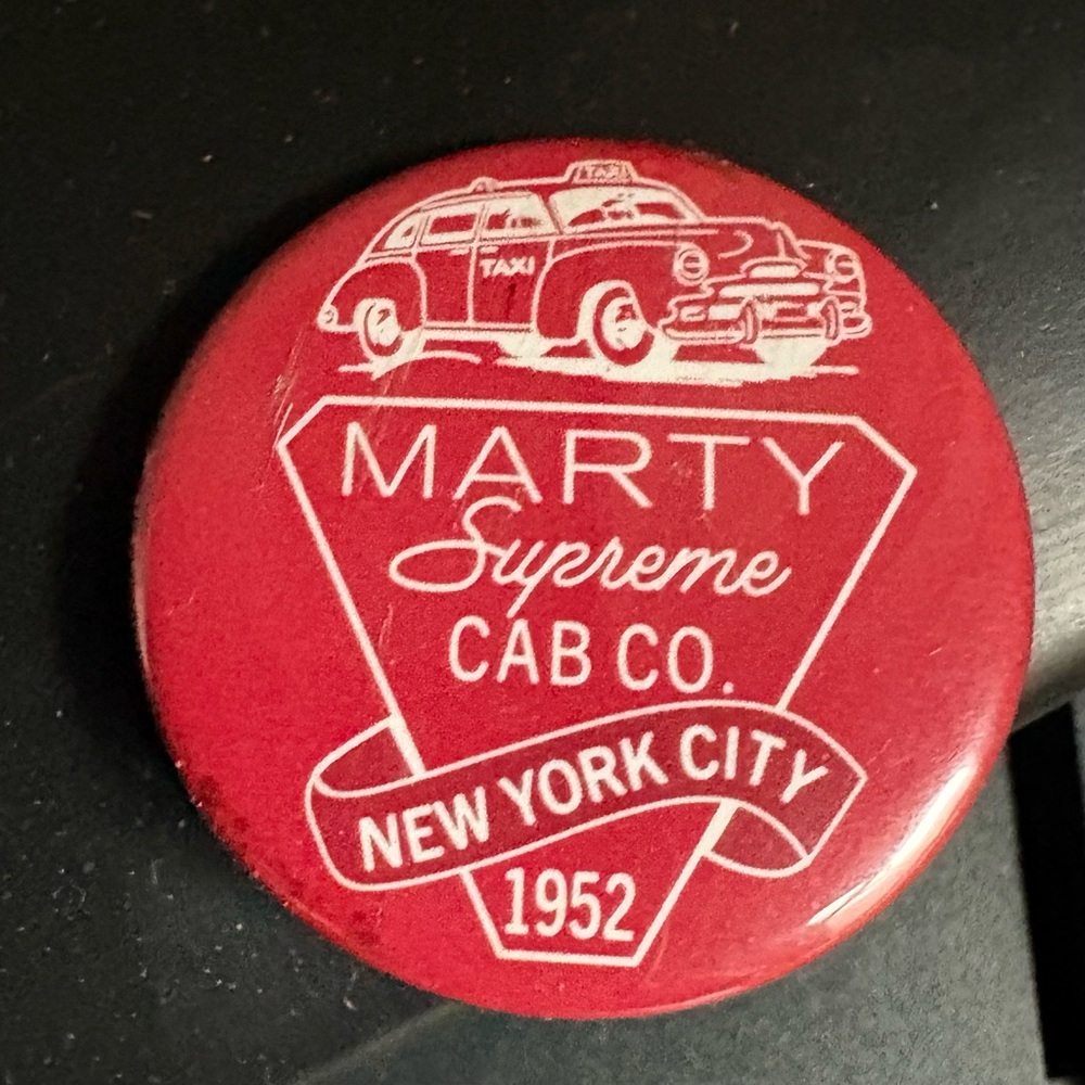 Marty Supreme Cab Co. Collectible pin, button, red